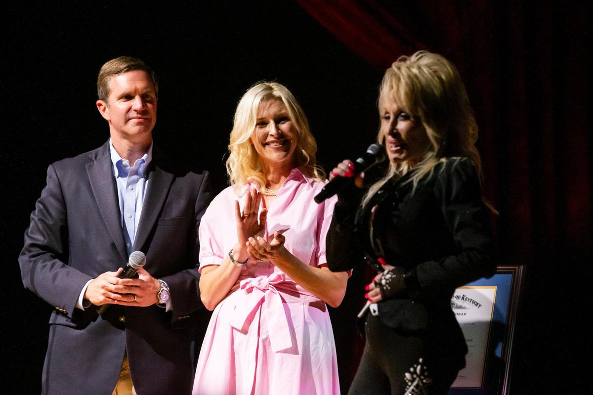 Dolly Parton speaks to the crowd after being commissioned as a Kentucky Colonel by Gov. Andy Beshear at the Lyric Theater in Lexington, Ky., on Tuesday, August 27, 2024.