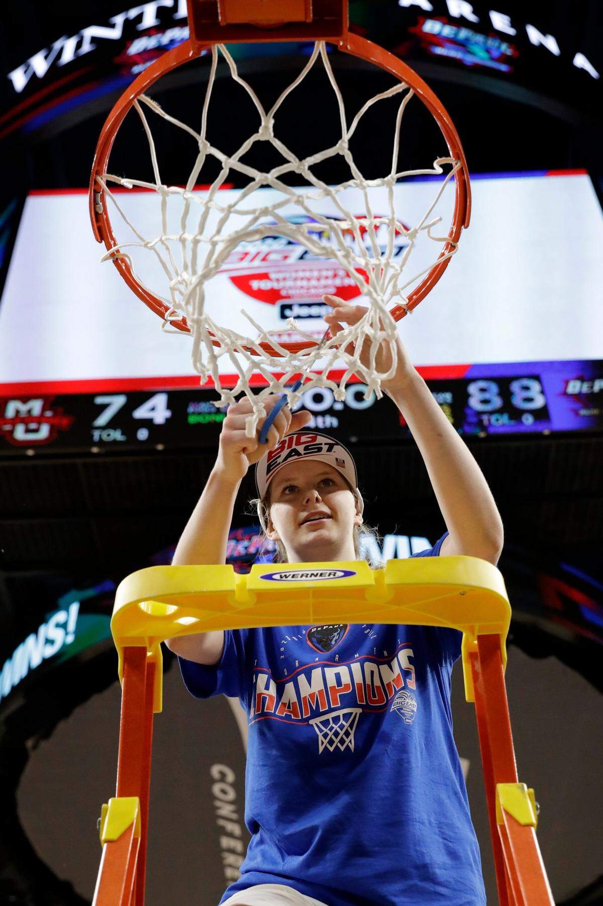 Lexi Held cuts down the net after leading DePaul to the Big East Conference Tournament championship in 2020. Because of the pandemic, the NCAA Tournament was called off that year.