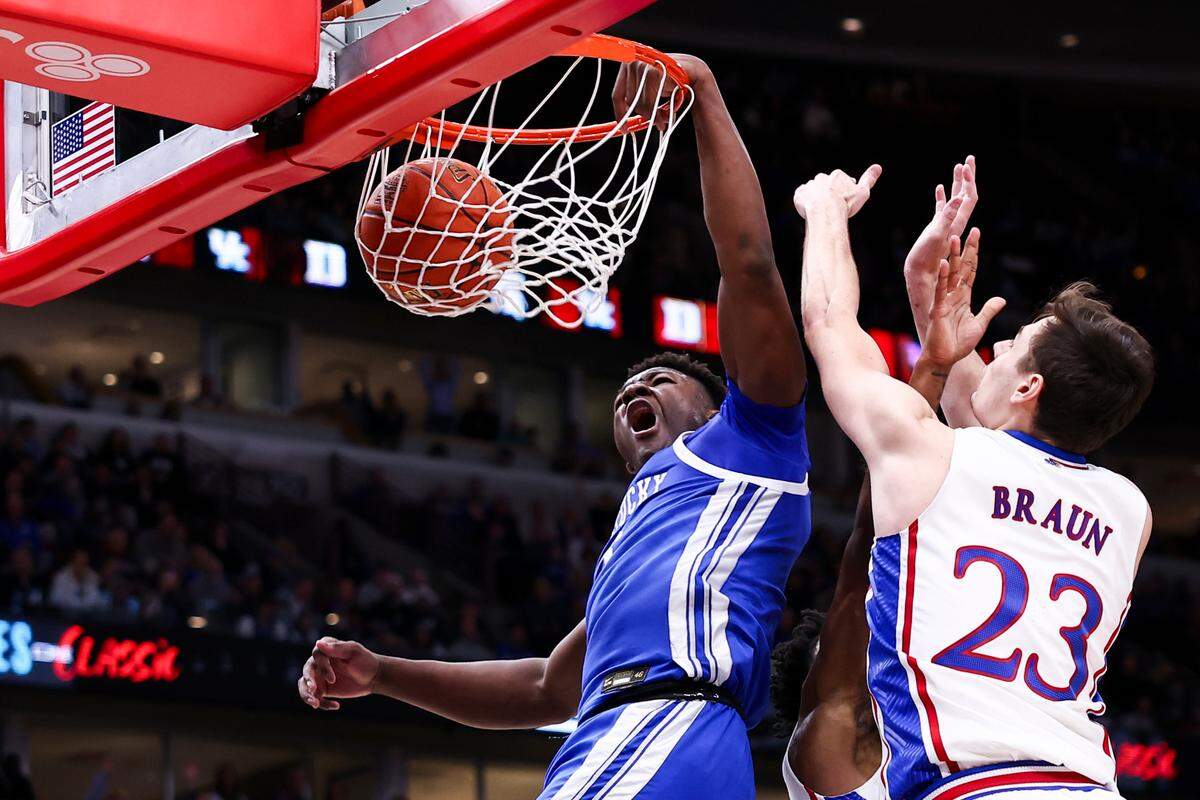 Kentucky’s Adou Thiero dunks a teammate’s miss during Tuesday’s game against Kansas in the Champions Classic in Chicago. Thiero finished with 16 points and 13 rebounds.