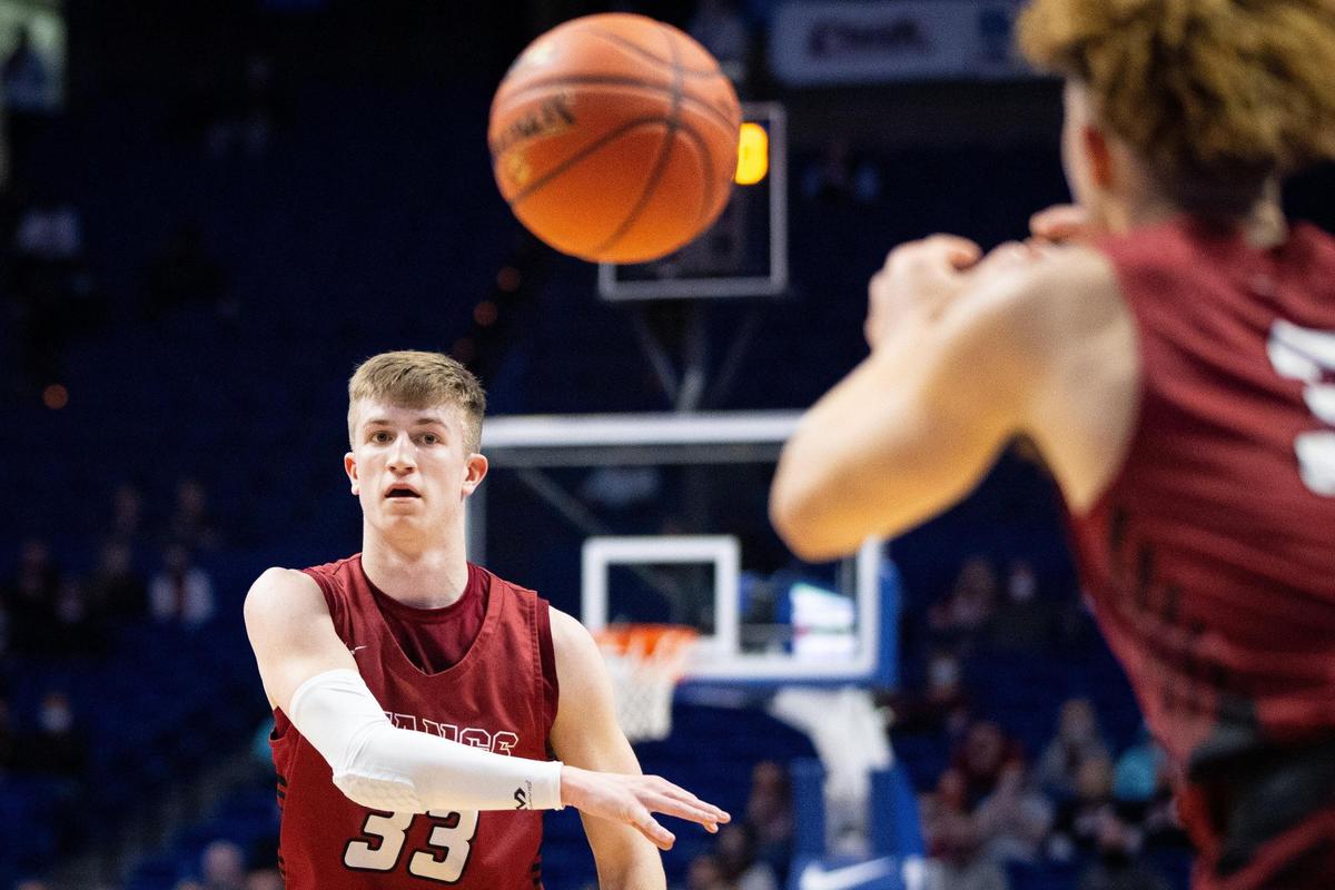 McCracken County senior Ian McCune (33) passes the ball to Noah Dumas during the first round of the Sweet 16.