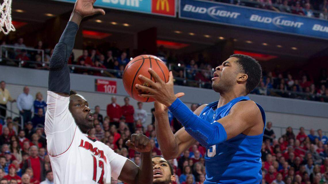 Kentucky guard Andrew Harrison drives to the basket in the first  half.          The University of Louisville hosted the University of Kentucky,  Saturday, Dec. 27, 2014 at Yum Center in Louisville.