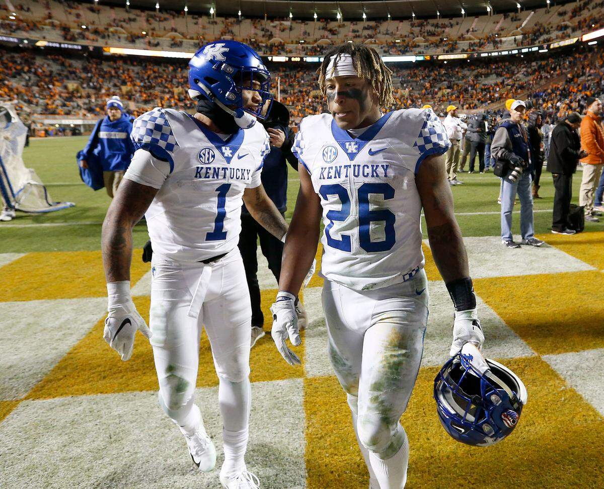 Kentucky stars Lynn Bowden, left, and Benny Snell walked off the field after the Cats’ 24-7 upset loss at Tennessee last year.