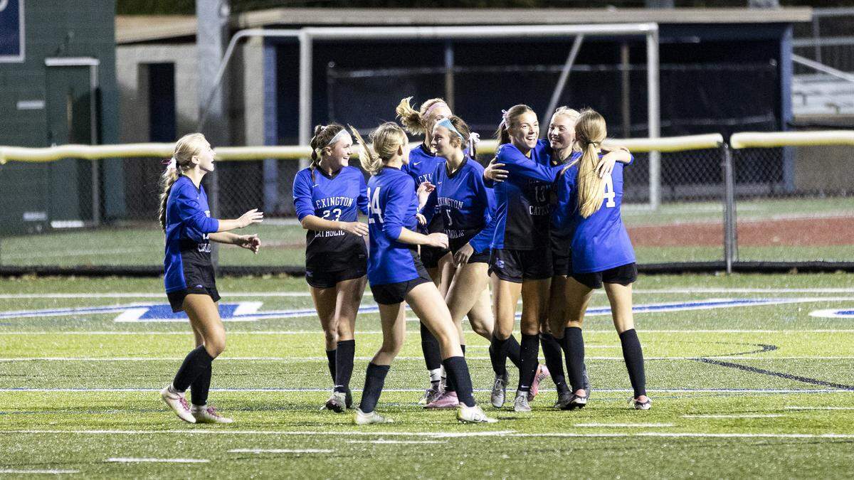 Lexington Catholic’s Eleanor Clay, second from right, was congratulated by her teammates after her second half goal in the first round of the KHSAA Girls State Soccer Tournament at Lexington Catholic High School in Lexington, Kentucky, on Tuesday, Oct. 21, 2025.
