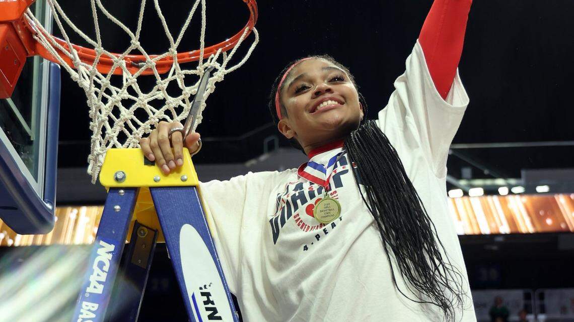 Sacred Heart’s ZaKiyah Johnson celebrates after winning the 2024 state championship in Rupp Arena, the school’s record fourth title in a row.