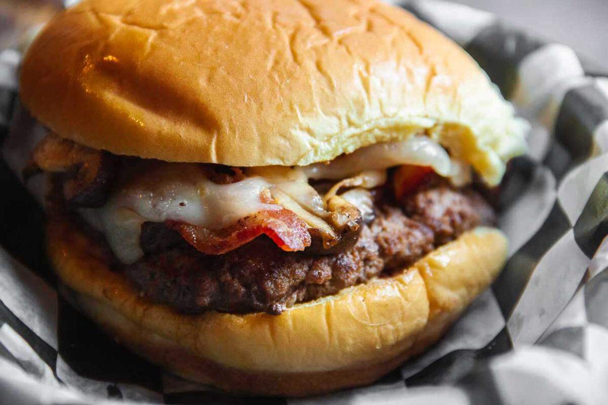 The Dr. Gonzo burger from Jack Brown’s Burger Joint is topped with sautéed shrooms, caramelized Guinness onions, applewood smoked bacon and Swiss cheese.