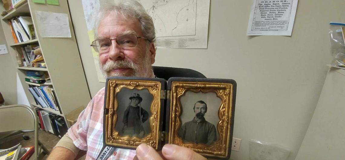 Stephen McBride, the archaeologist who serves as the director of interpretation at Camp Nelson, holds portraits of soldiers, which were popular items. McBride and his team found a photo studio, one of several known to be at the camp.