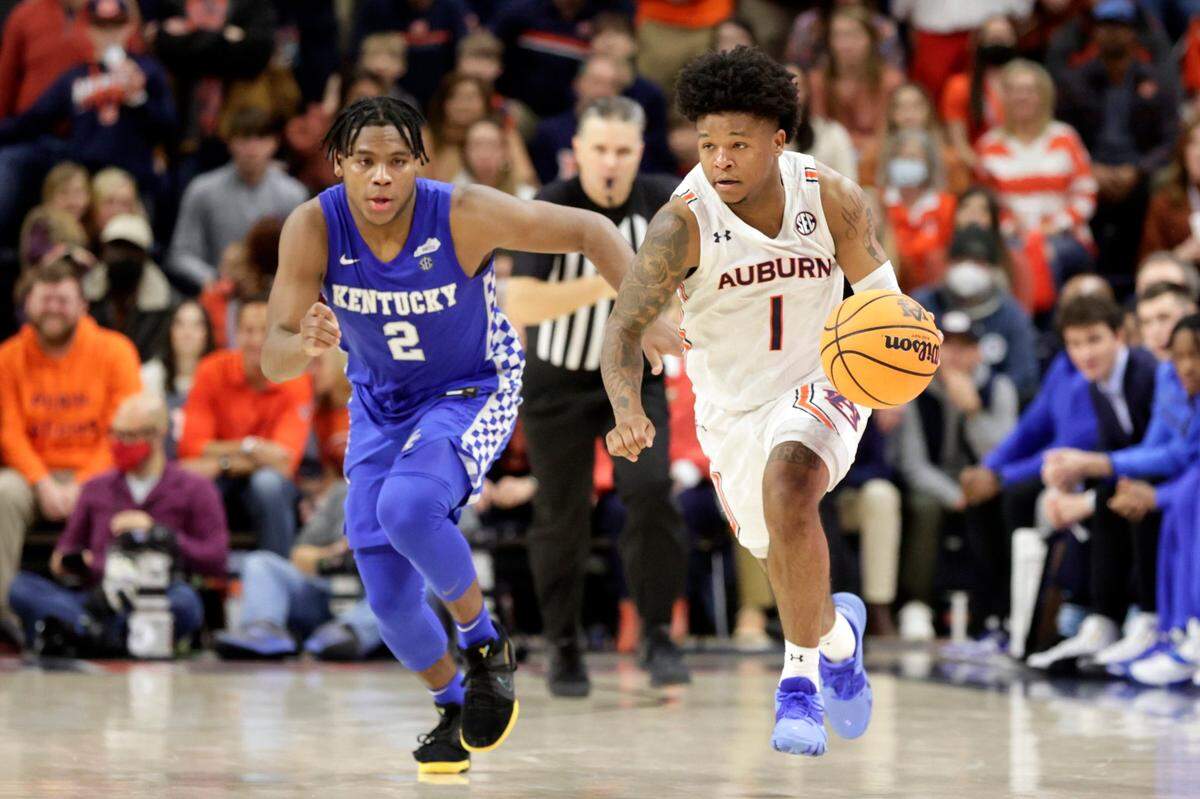 Auburn’s Wendell Green Jr. (1) brings the ball down court against Kentucky’s Sahvir Wheeler (2) on Jan. 22 at Auburn. The first-place Tigers and second-place Wildcats will not meet again during the regular season.