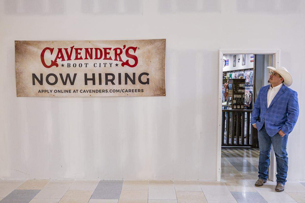 Erik Garza looks at the Cavender’s sign during a tour on Thursday, Aug. 21, 2025, at Fayette Mall in Lexington, Ky. 