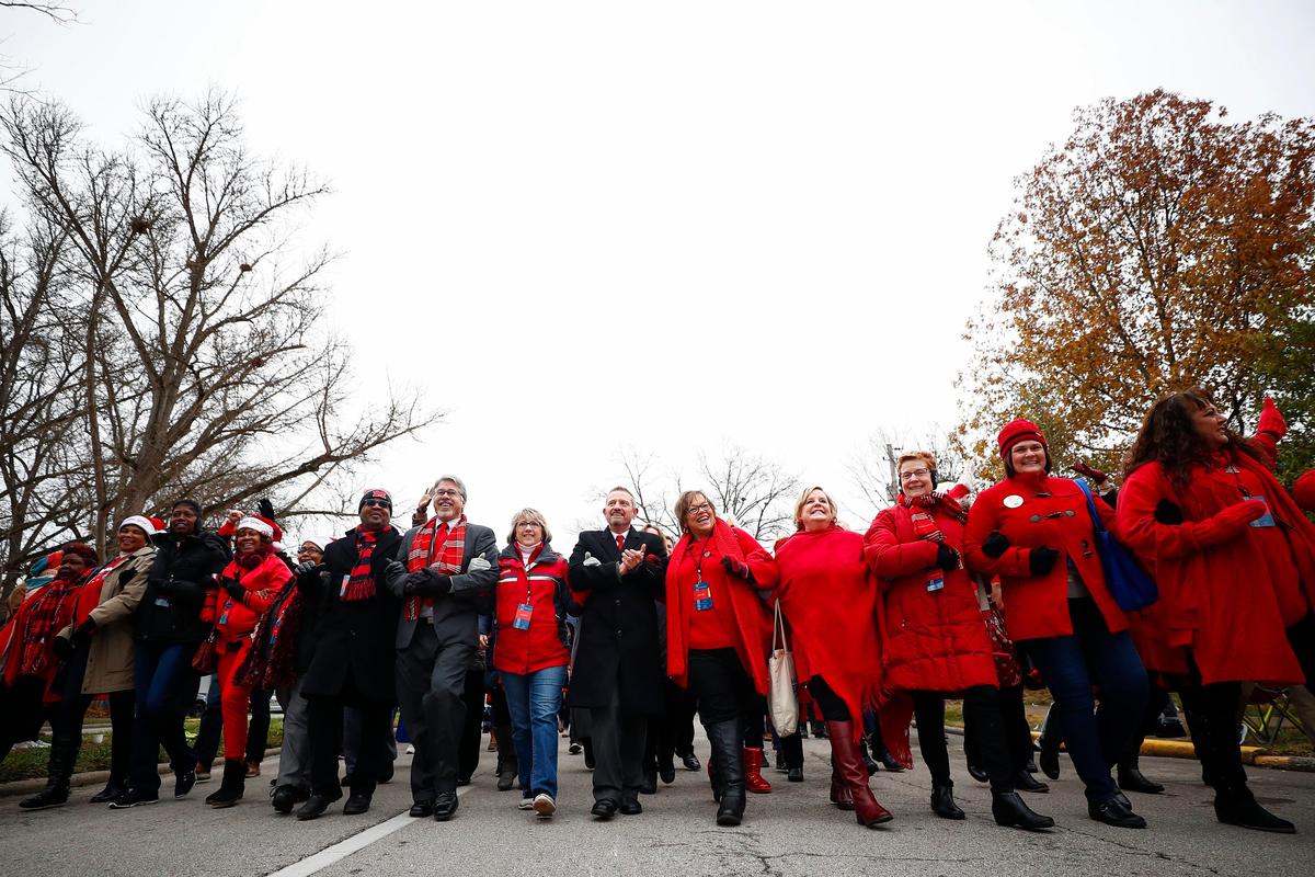 Members of the Jefferson County Teachers Association march down Capital Ave. during the inaugural parade in Frankfort, Ky., Tuesday, Dec. 10, 2019.