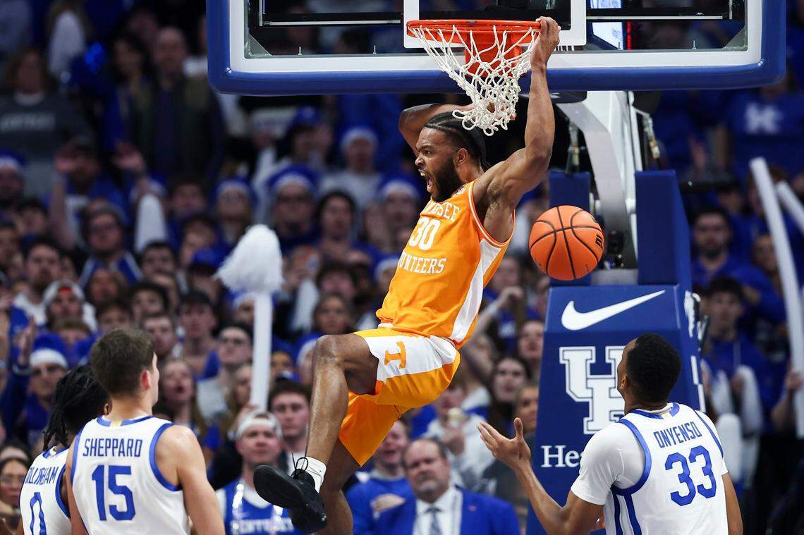 Tennessee guard Josiah-Jordan James (30) dunks the ball to score against Kentucky during the game at Rupp Arena on Saturday.
