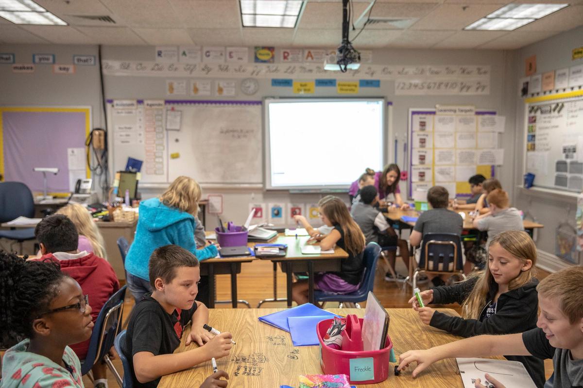 Students work in teacher Lisa Hanson’s fifth grade math class at Garth Elementary School in Scott County on Monday.