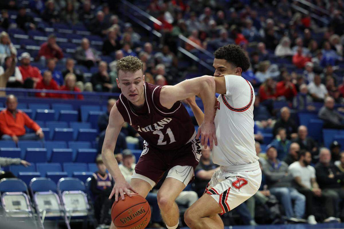 Ashland Blazer’s Rheyce DeBoard fought off an Owensboro defender during Wednesday night’s win. DeBoard scored 17 points for the Tomcats.