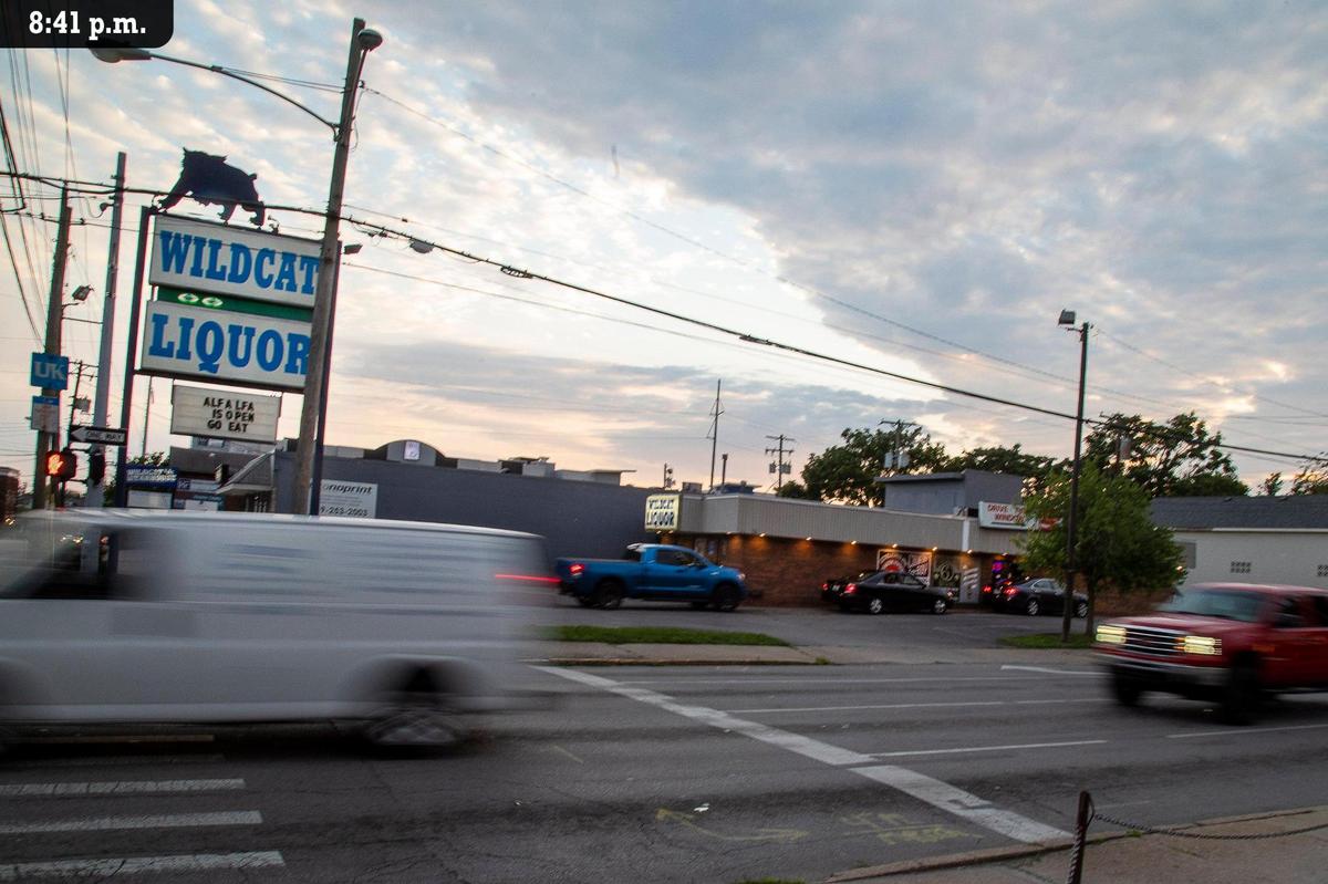 Cars go down Lexington’s West Maxwell Street as people wait in the drive-thru line at Wildcat Liquor, Friday, July 9. The downtown liquor store is known for getting some rare bourbon’s in stock and letting customers know on their social media pages. But rare bourbon wasn’t the No. 1 item on people’s minds as they went through the drive-thru this night according to employee Zachery Byram. He says the most requested item was Fireball Cinnamon Whisky. “A lot of Fireball,” he said. The liquor store has been drive-thru only since the COVID pandemic began and Byram said it might become permanent since it gives them more storage.