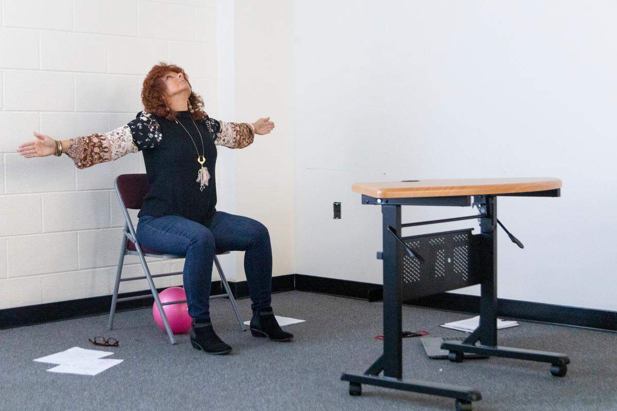 Health Educator, Mary Beth Castle, conducts her weekly gentle chair yoga classes over Facebook live at the Johnson County Public Health Department in Paintsville on December 15, 2020. “We wanted to provide a sense of normalcy during the pandemic, because everything has just been turned upside-down,” she said.