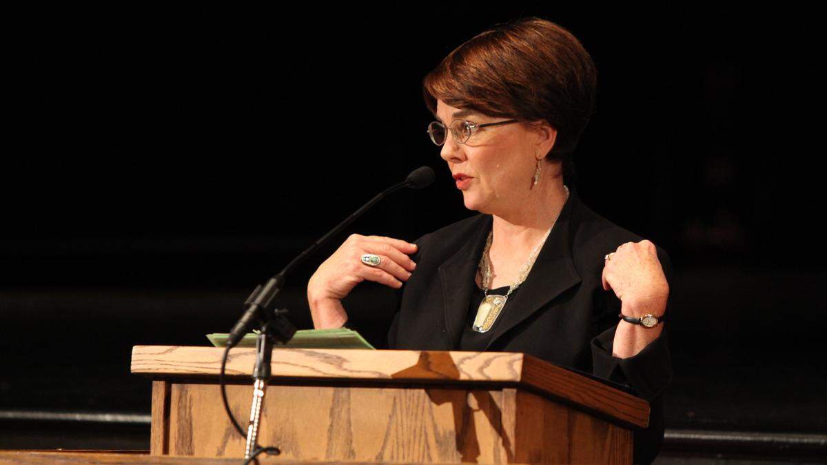 Pam Sexton, widow of Robert F. Sexton, spoke about how he had always said when you speak you carry people on your shoulder - and she was illustrating that she is carrying him on hers during the celebration of life in his honor in Haggin Auditorium at Transylvania University on Saturday October 16, 2010.  Photo by Jason Sankovitch