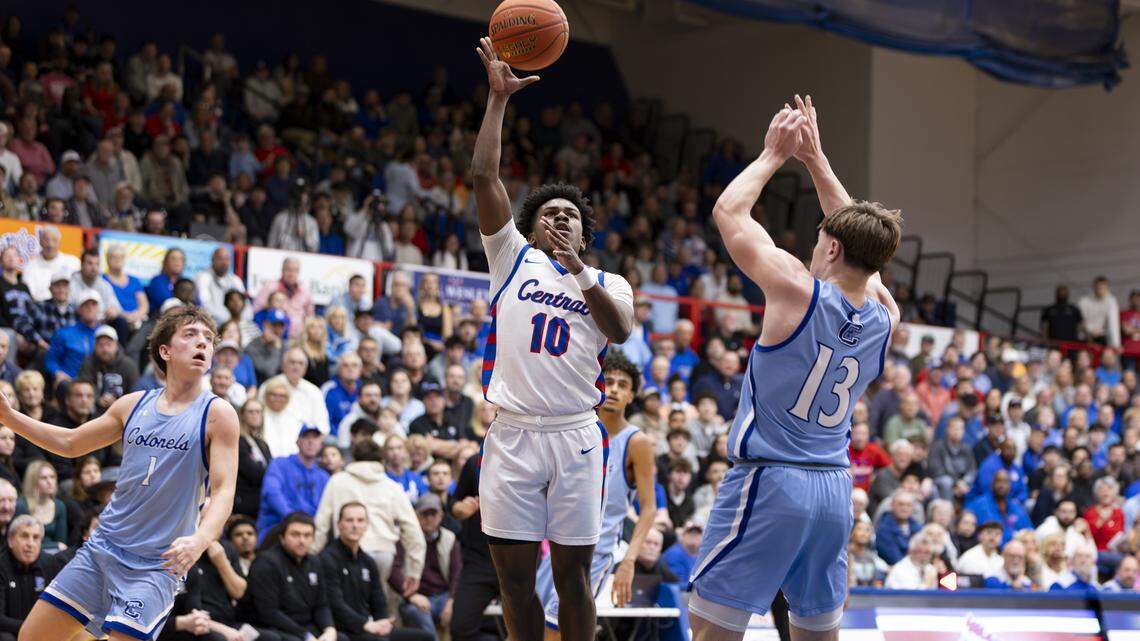 Madison Central’s Cam Steele (10) drives to the basket against Covington Catholic’s Teegan Stava (13) as teammate Athens McGillis (1) trails the play in the Indians’ 70-60 win at Madison Central High School in Richmond on Friday.