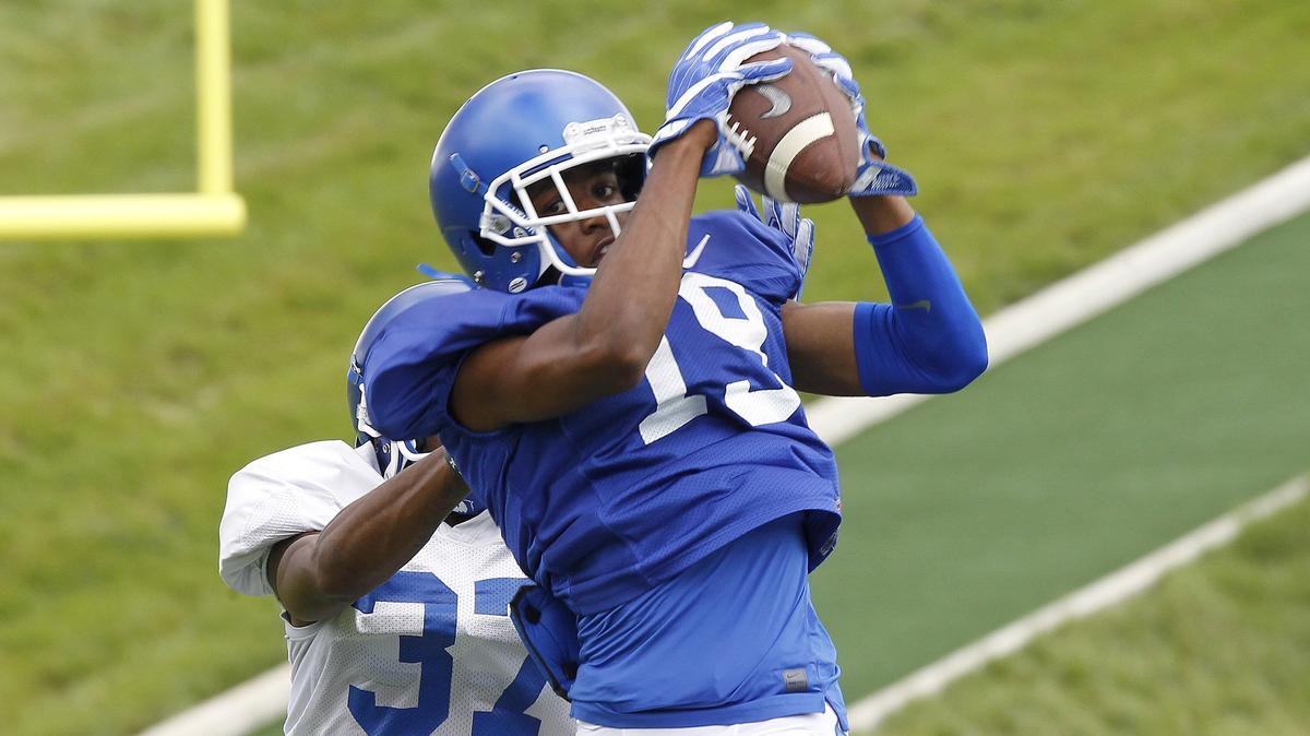 Wide receiver Akeem Hayes (19) probably is one of several true freshmen who have played themselves onto the field this season, Coach Mark Stoops said. Hayes’ wide receivers coach Michael Smith described the 5-foot-8 slot as “a guy with tremendous quickness.”