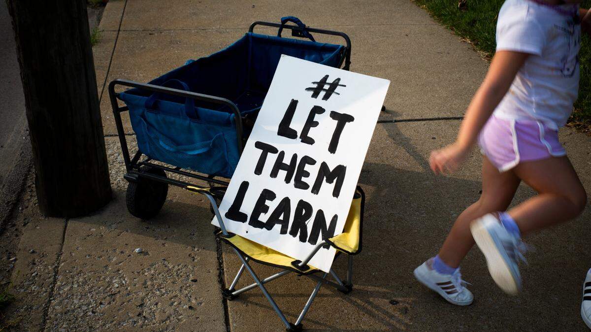 Students and parents participate in the Let Them Learn rally and protest outside the Fayette County Public Schools central office in Lexington, Ky, on Monday, September 14, 2020.