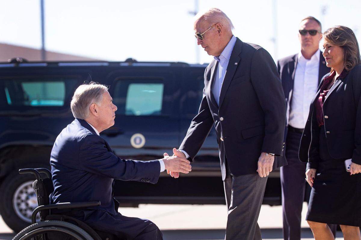 President Joe Biden exchanges handshakes with Texas Gov. Greg Abbott when the president arrived in El Paso Jan. 8, 2023 to assess border enforcement operations and meet with community leaders coping with a historic number of migrants fleeing political oppression and gang violence in Venezuela, Haiti, Nicaragua, and Cuba.