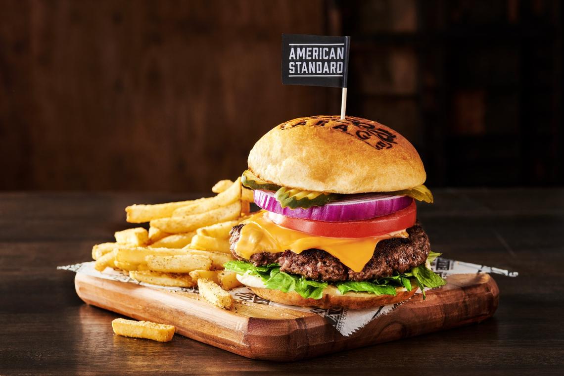 The American Standard burger ($15.50) at Ford’s Garage comes with American cheese, lettuce, tomato, red onion and pickle planks on a brioche bun.