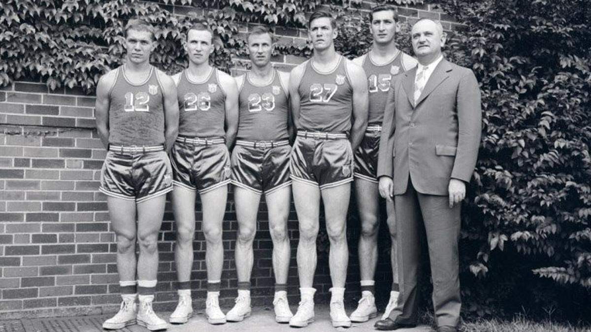 Kentucky men’s basketball players in their 1948 Olympic uniforms, from left: Ralph Beard, Kenny Rollins, Cliff Barker, Wallace “Wah Wah” Jones and Alex Groza, along with Coach Adolph Rupp