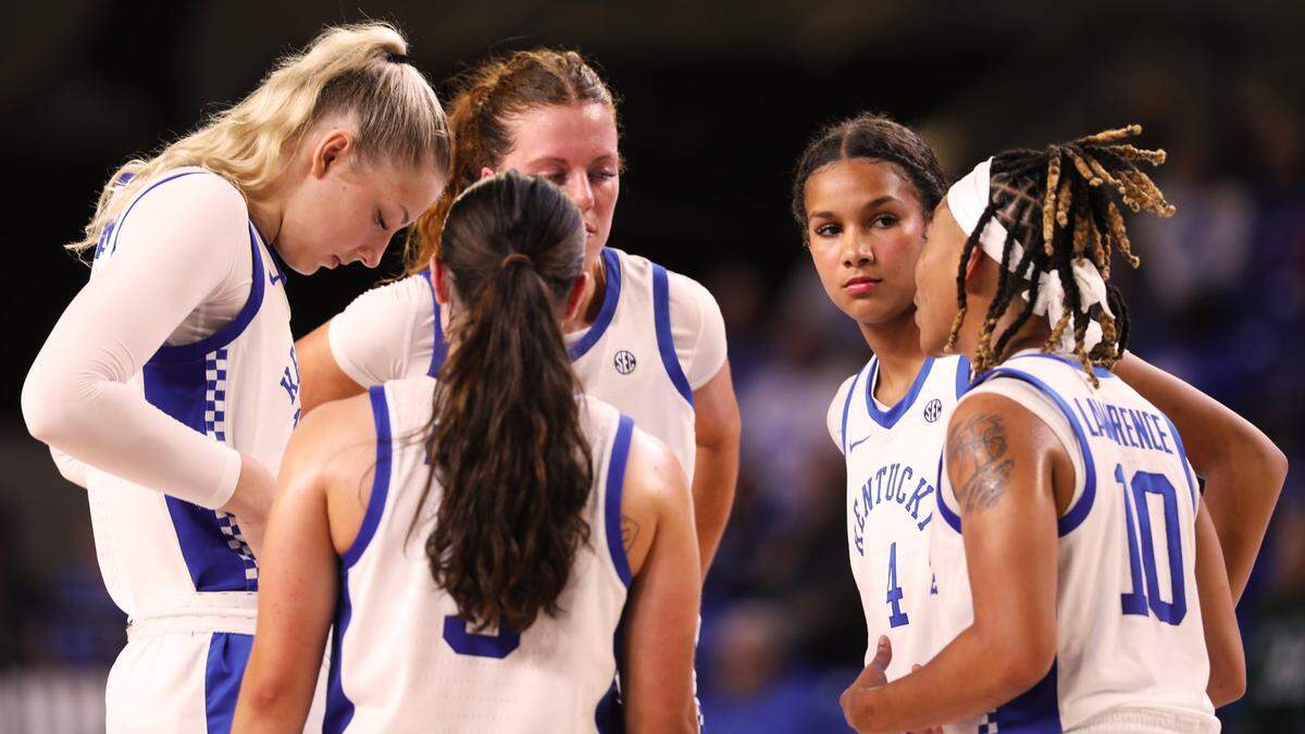 The Kentucky women’s team gets a pep talk from guard Dazia Lawrence (10) during the the team’s season opener against USC Upstate on Monday at Memorial Coliseum.