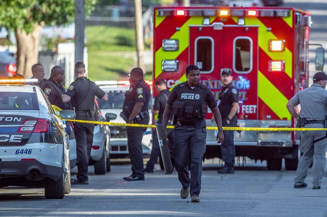 Members of the Lexington police and fire departments, along with the Kentucky State Police, respond to a report of a shooting on Devonia Avenue in Lexington, Ky., on Thursday, Sept. 8, 2022.