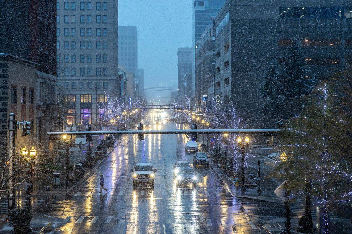 Snow falls during the morning commute in downtown Lexington, Ky., Monday, Nov. 30, 2020.