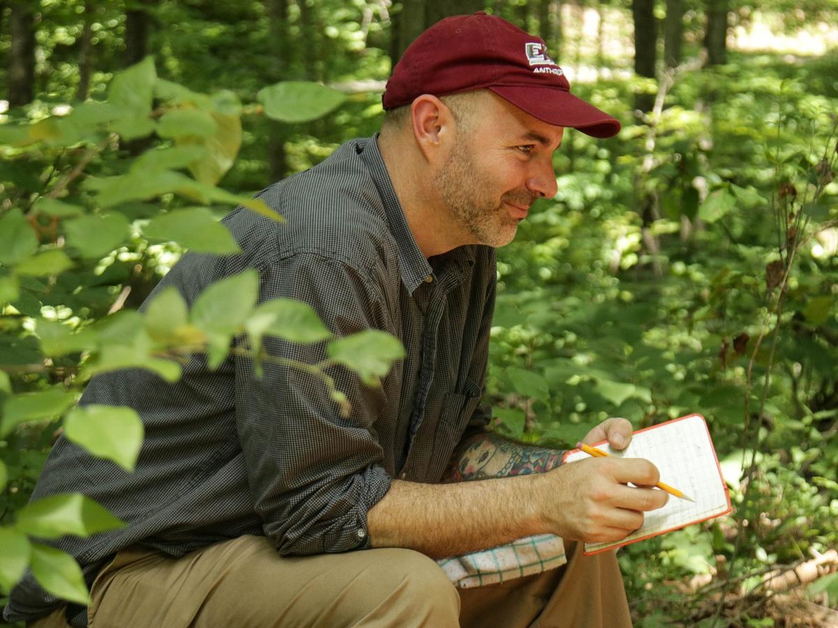 Dr. Jon Endonino takes notes during an archeological dig in Daniel Boone National Forest.