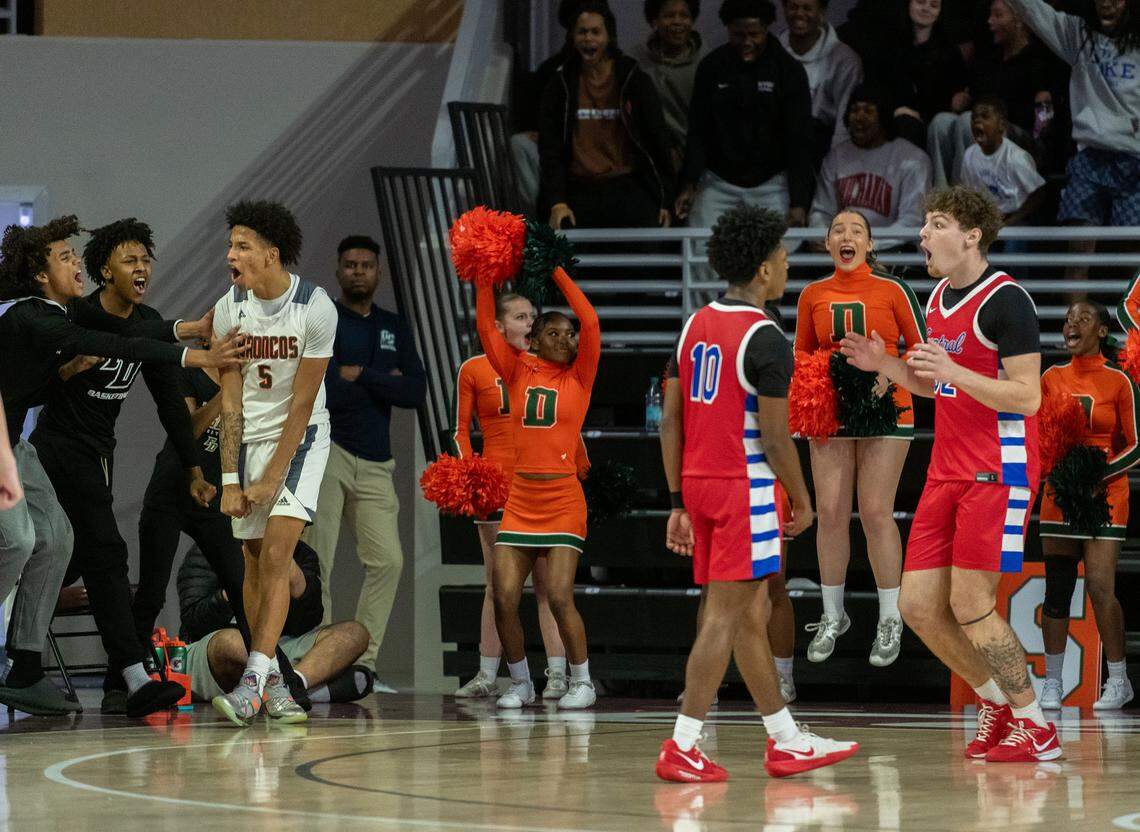 Frederick Douglass' Naz Gillispie (5) celebrates after scoring and getting fouled in the boys 11th Region Tournament semifinals on Saturday at Eastern Kentucky University’s Baptist Health Arena in Richmond.