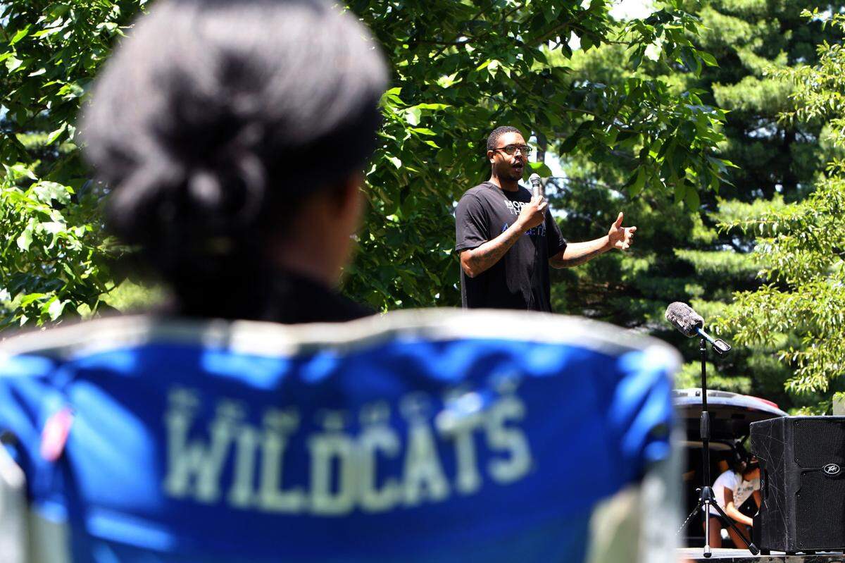 Former Kentucky basketball player Erik Daniels spoke at the Walk Forward Lexington rally at Woodland Park on Saturday.