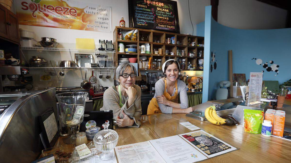 Owner Joann Prosser, left, and Meg Toole at Squeeze, a juice and raw foods bar inside Centered, at 309 North Ashland Avenue. They sell raw juices and treats that are vegan, organic and gluten free. 