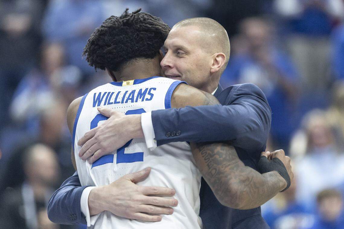 Kentucky center Amari Williams is hugged by Wildcats head coach Mark Pope during Senior Night on March 4.