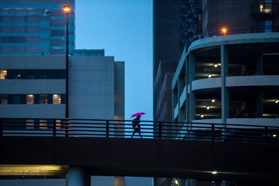 A pedestrian crosses the overpass on Martin Luther King Boulevard in downtown Lexington, Ky., on Friday, Jan. 3, 2020.