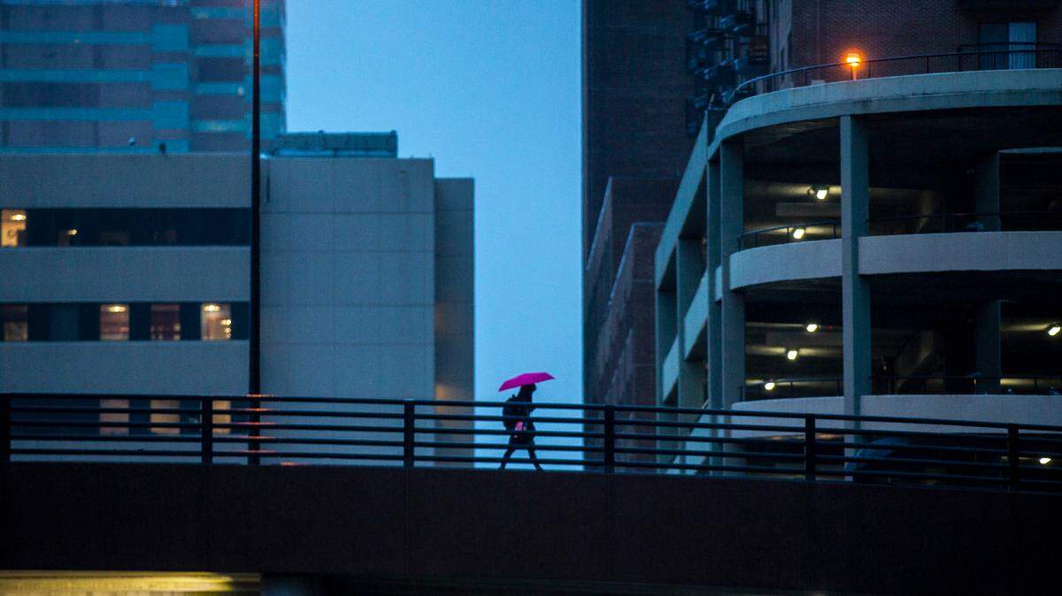 A pedestrian crosses the overpass on Martin Luther King Boulevard in downtown Lexington, Ky., on Friday, Jan. 3, 2020.