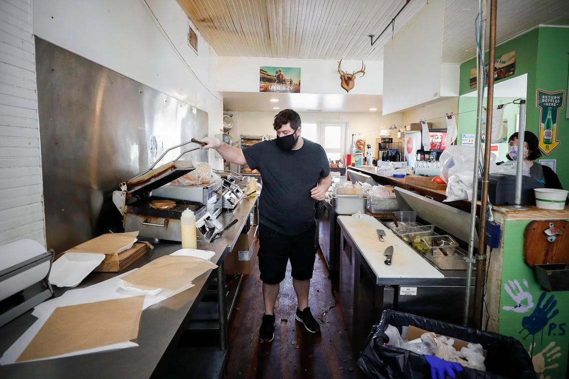 Wallace Station general manager Dante Galtieri works the sandwich press at Wallace Station. Wallace Station is currently offering call ahead takeout orders and opens at 11 a.m. every day except Tuesday.