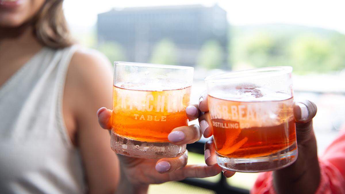 Female bourbon fans gather annually for the Bourbon Women SIPosium in Louisville to sample whiskey and share their passion for bourbon.