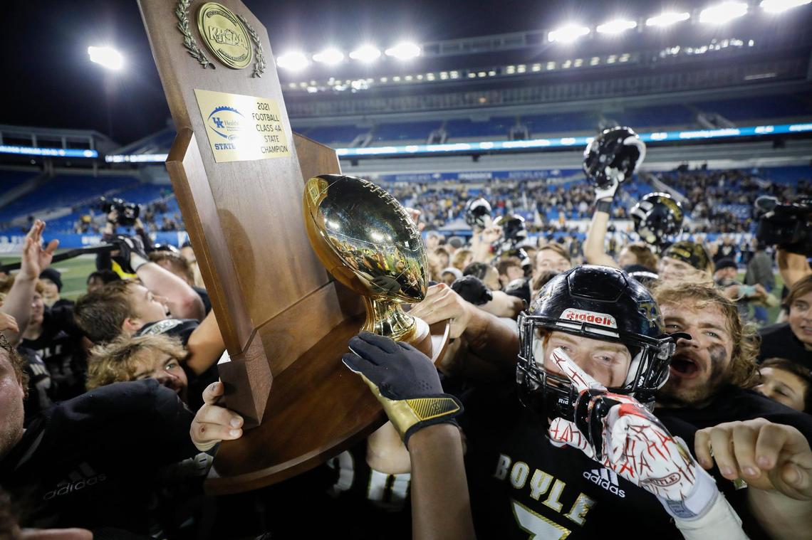 Boyle County celebrates with the trophy after defeating Johnson Central to win the Class 4A title at Kroger Field on Friday night.