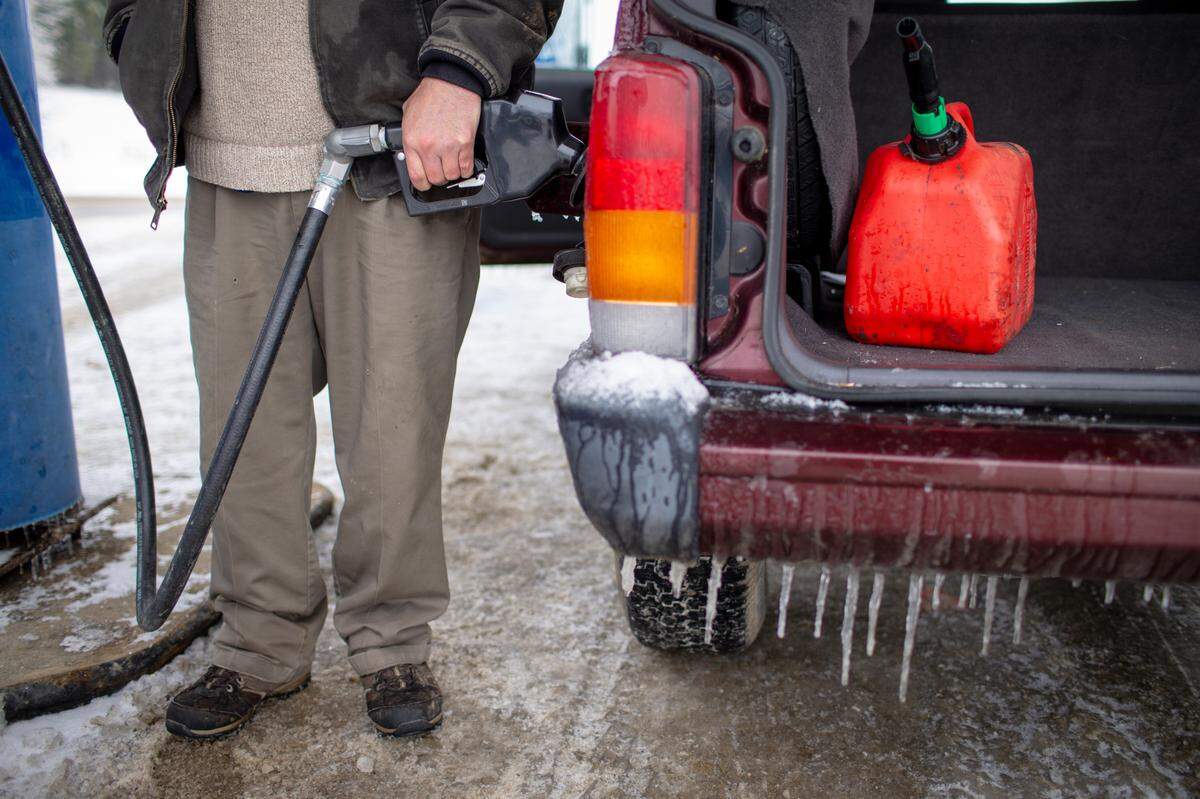 Jerry Sparks fills up gas cans for his Jeep and generator for his home in New Zion at the Gray Hawk Landing in Jackson County, Ky., Wednesday, February 17, 2020. The National Weather Service has forecasted another winter storm to drop more snow Wednesday night and Thursday.