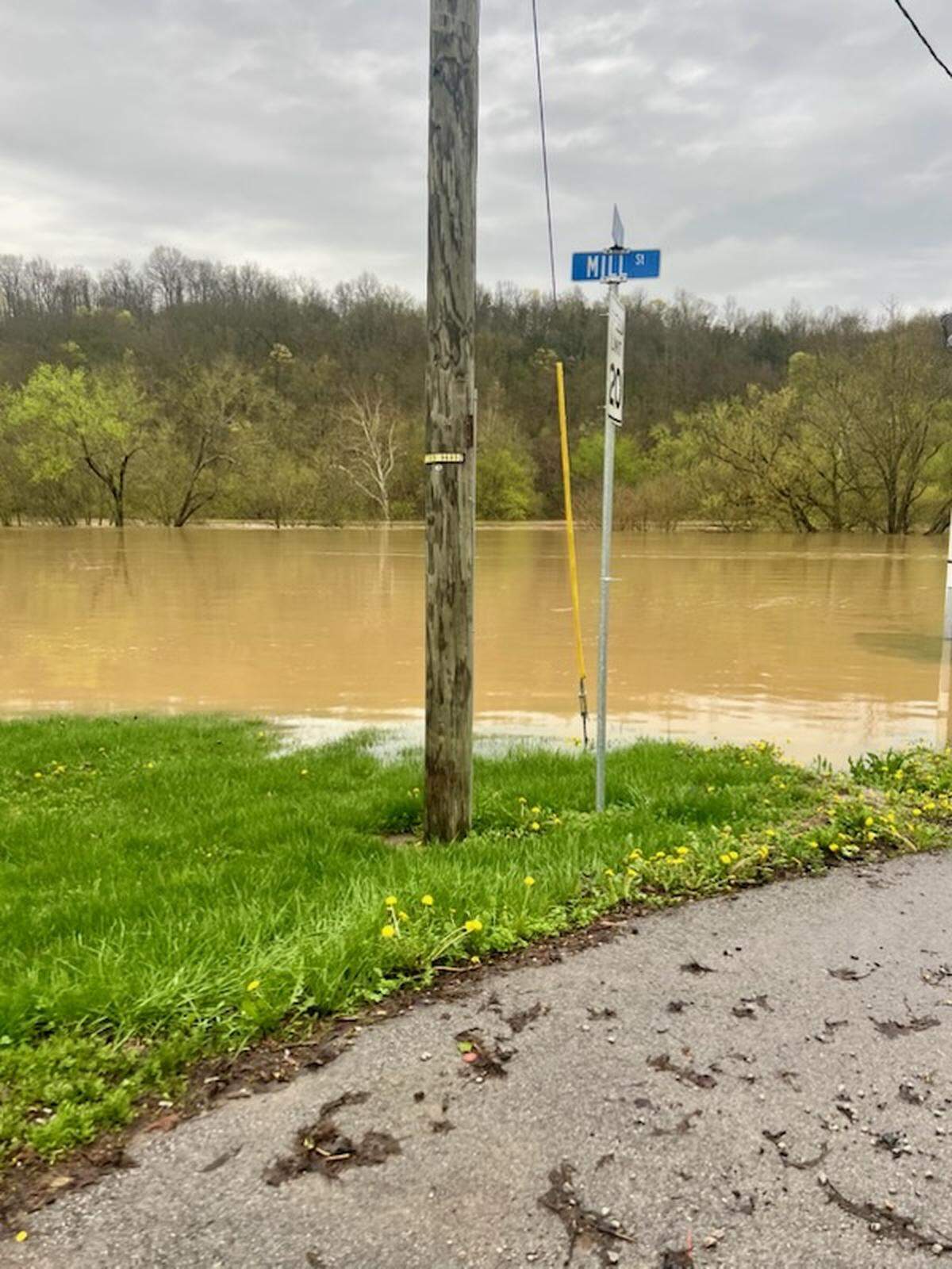 Floodwaters rise Saturday, April 5, 2025, in Butler. Pendleton County officials issued an emergency evacuation order for Falmouth and Butler, and several access points to the cities were shut off Sunday.