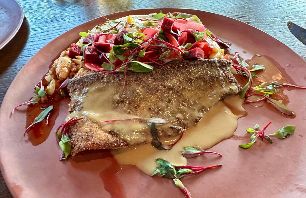 Pan seared trout at Granddam, located in the Manchester Hotel in Lexington’s Distillery District, July 14, 2024. The trout was served with lump crab & tazo ham succotash, whole grain mustard beurre meunière, Kenny’s Farmhouse cheese grits, pickled radish and garlic cornbread pangrattato.