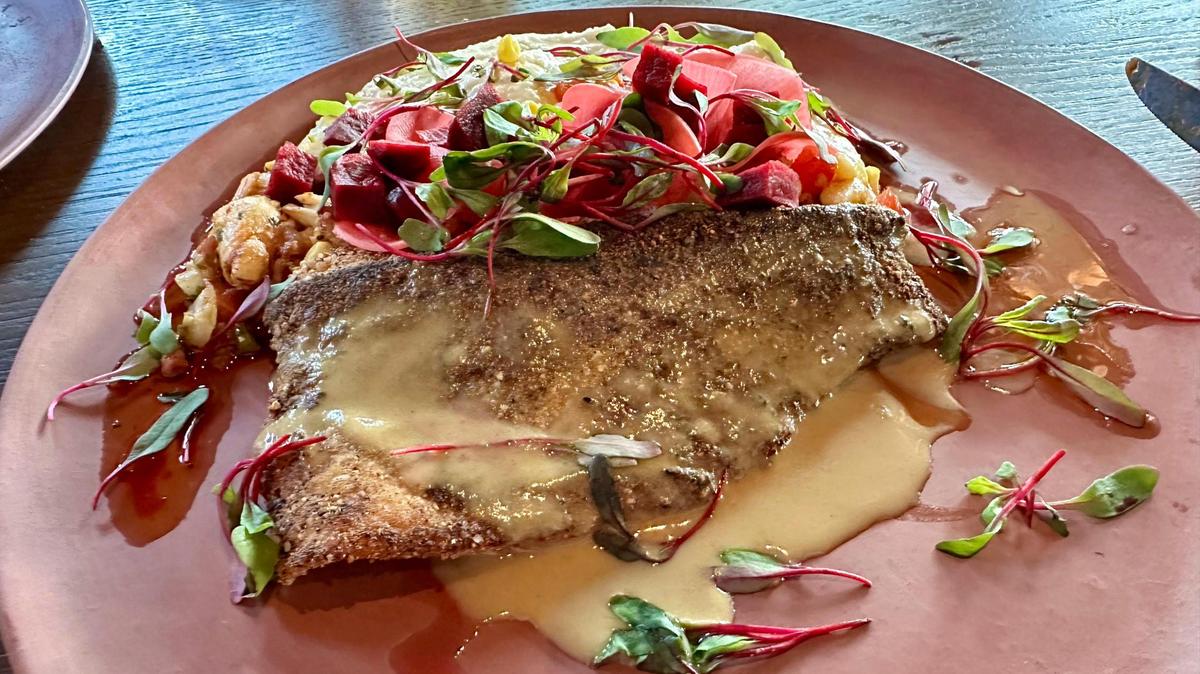 Pan seared trout at Granddam, located in the Manchester Hotel in Lexington’s Distillery District, July 14, 2024. The trout was served with lump crab & tazo ham succotash, whole grain mustard beurre meunière, Kenny’s Farmhouse cheese grits, pickled radish and garlic cornbread pangrattato.