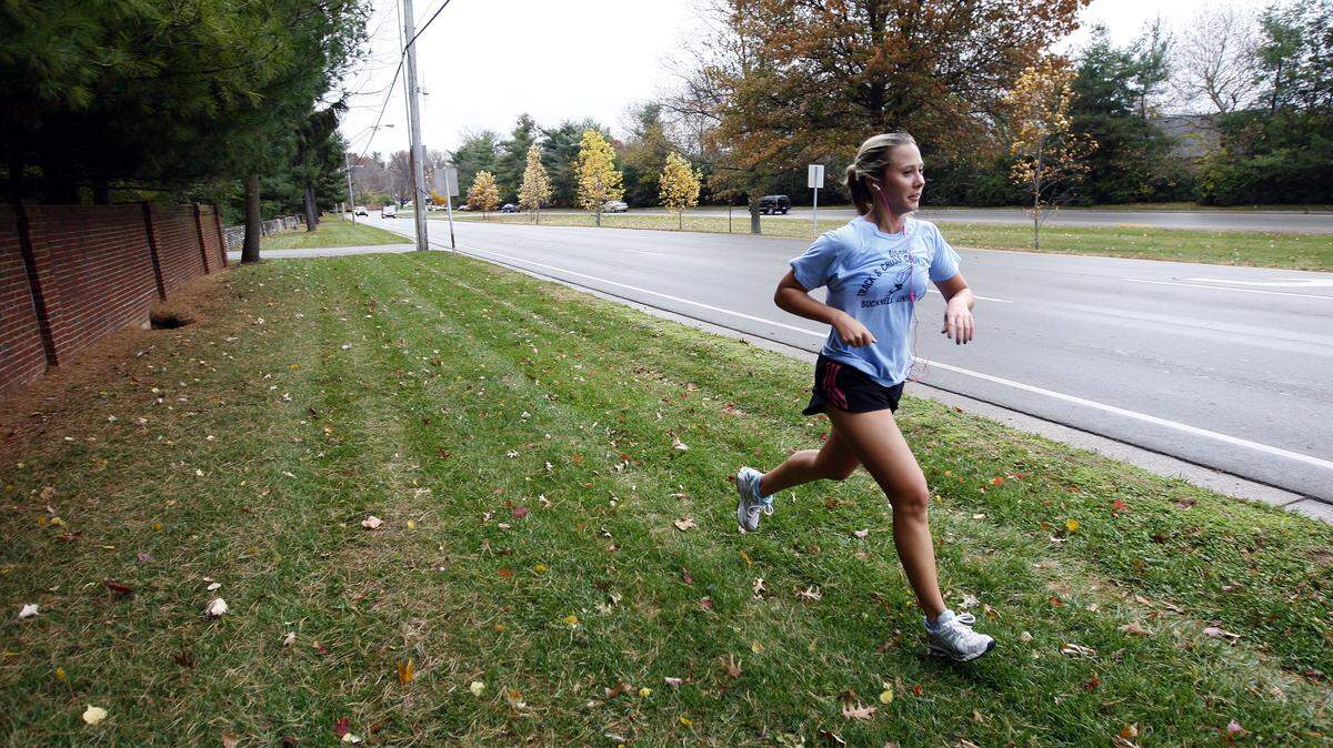 Elizabeth Petrun went for a run Wednesday on a grassy stretch along Tates Creek Road, an area where sidewalks have been on the drawing board since 2009. The city has just begun to talk with landowners about right-of-way issues.