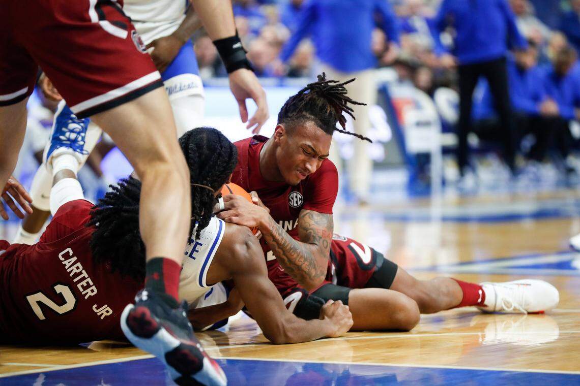Kentucky’s Cason Wallace battles for control of the ball against South Carolina on Tuesday, Jan. 10, 2023, at Rupp Arena in Lexington, Ky.