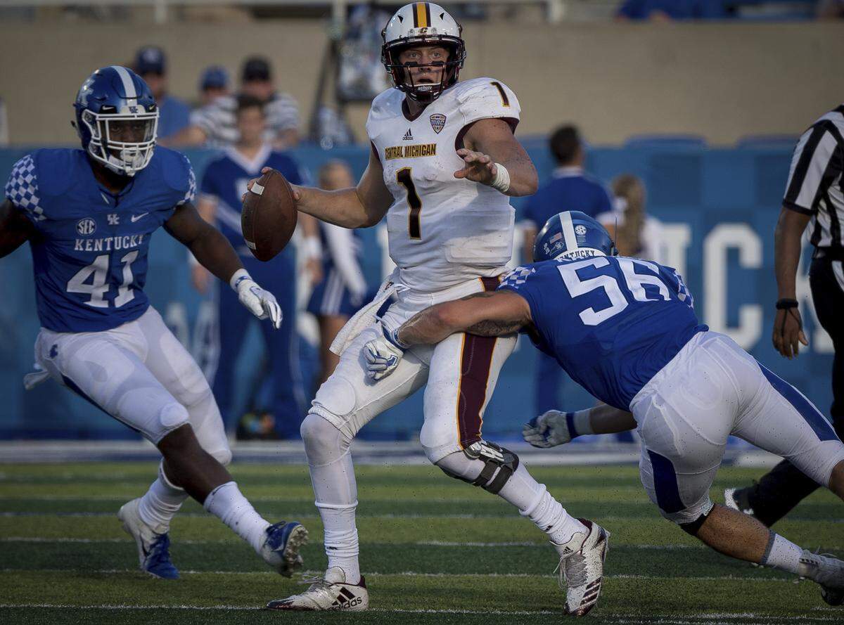 Kentucky’s Kash Daniel (56) went in to tackle Central Michigan quarterback Tony Poljan in the season opener on Saturday. In his first career start, Daniel led UK in tackles with 11, including two quarterback hurries.