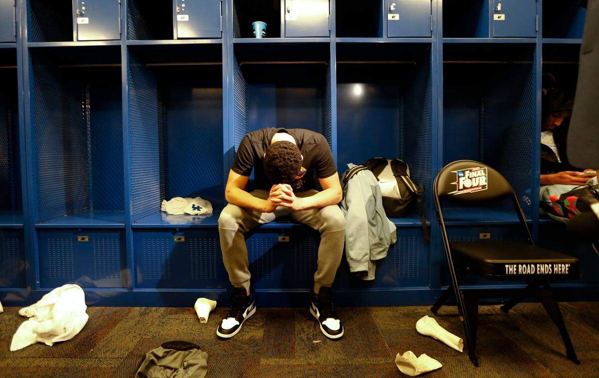 Kentucky’s Devin Booker sat at his locker after UK’s loss to Wisconsin in the 2015 Final Four in Indianapolis.