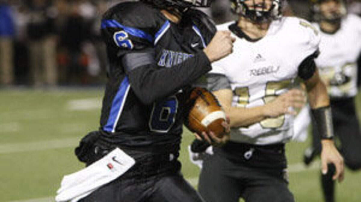 LexCath quarterback Reese Ryan makes a 47-yard run against Boyle Co. during the regional championship at Lexington Catholic football stadium in Lexington, Ky., Friday, November 21, 2014. Photo by Matt Goins