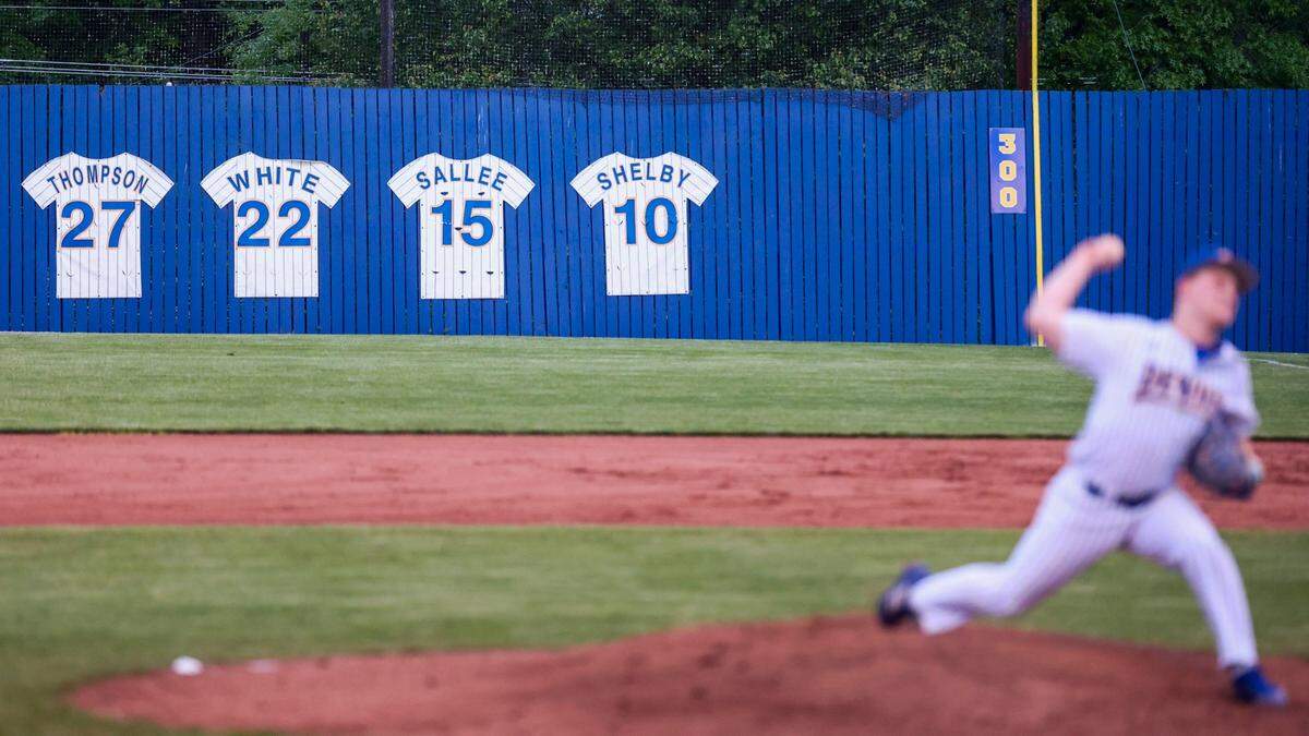 Henry Clay’s John Ritchie pitches as retired jerseys line the right field wall during a game against Scott County on Wednesday at the Blue Devils’ baseball stadium. This is the final season of baseball at the stadium, which was built in 1971. Demolition of the baseball and softball fields is scheduled to begin June 1.