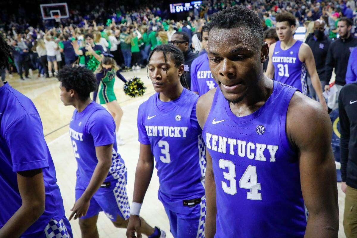 Kentucky’s TyTy Washington (3) and Oscar Tshiebwe (34) left the court as Notre Dame fans celebrated their team’s victory at the Purcell Pavilion at the Joyce Center in South Bend, Ind., on Saturday.