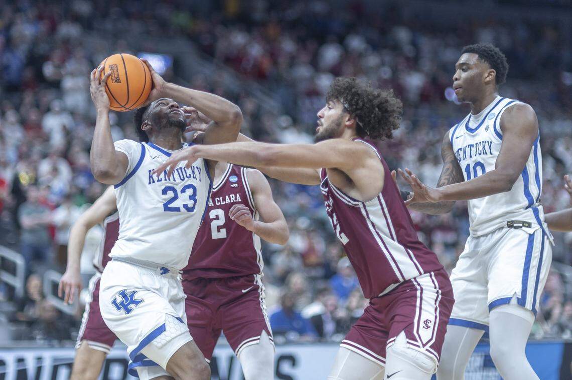 Kentucky forward Mouhamed Dioubate (23) looks to shoot the ball past Santa Clara guard Sash Gavalyugov (2) and Santa Clara forward Allen Graves (22) during the first round of the NCAA men’s basketball tournament at Enterprise Center in St. Louis, Mo., on Friday, March 20, 2026.